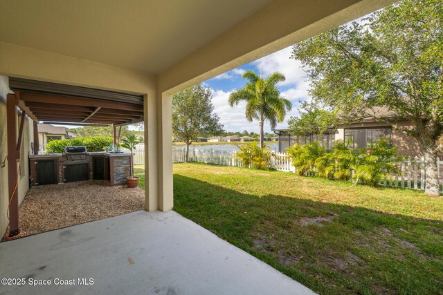 681 Dillard Dr SE, Palm Bay, FL 32909 - view of yard featuring a patio and a water view