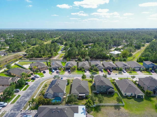 681 Dillard Dr SE, Palm Bay, FL 32909 - aerial view of residential area with a heavily wooded area