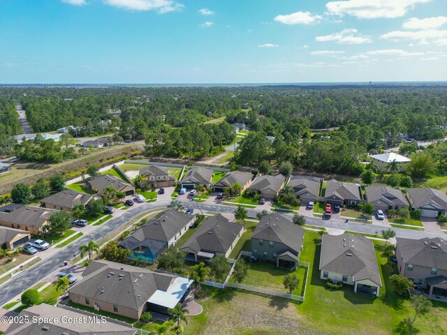 681 Dillard Dr SE, Palm Bay, FL 32909 - aerial view of residential area with a heavily wooded area