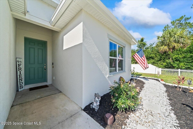 1160 Larkspur St SE, Palm Bay, FL 32909 - doorway to property with stucco siding