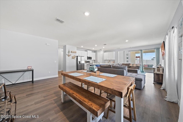1160 Larkspur St SE, Palm Bay, FL 32909 - dining space with dark wood finished floors, recessed lighting, and baseboards
