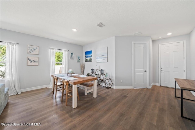 1160 Larkspur St SE, Palm Bay, FL 32909 - dining space with baseboards, wood finished floors, recessed lighting, and a textured ceiling