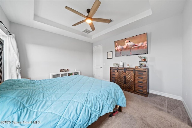 1160 Larkspur St SE, Palm Bay, FL 32909 - bedroom with a tray ceiling, carpet, baseboards, and a ceiling fan