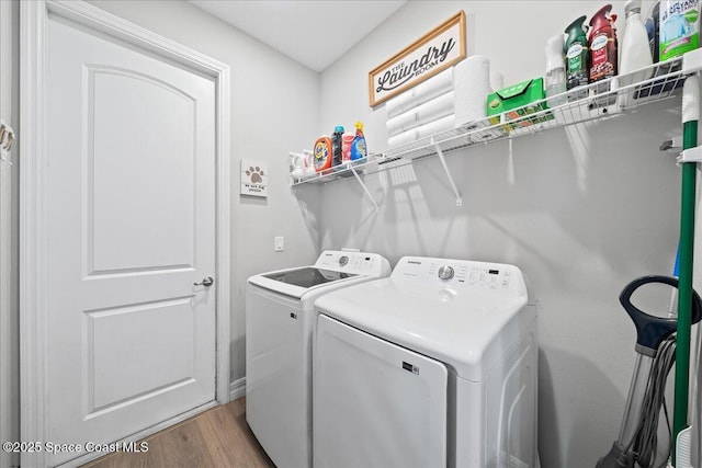 1160 Larkspur St SE, Palm Bay, FL 32909 - washroom with washer and dryer and light wood-style flooring