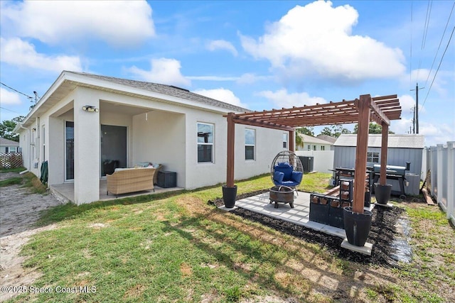 1160 Larkspur St SE, Palm Bay, FL 32909 - back of house with an outdoor fire pit, a patio, a pergola, stucco siding, and central air condition unit