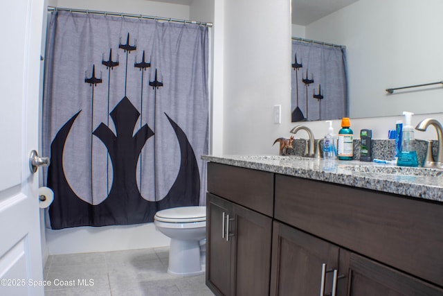 1059 Dusseldorf Ave NW, Palm Bay, FL 32907 - bathroom with toilet, vanity, and tile patterned floors