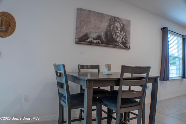 1059 Dusseldorf Ave NW, Palm Bay, FL 32907 - dining area featuring baseboards and light tile patterned flooring