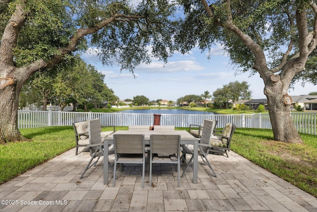 5060 Spinet Dr, Melbourne, FL 32940 - view of patio / terrace featuring a water view and outdoor dining area
