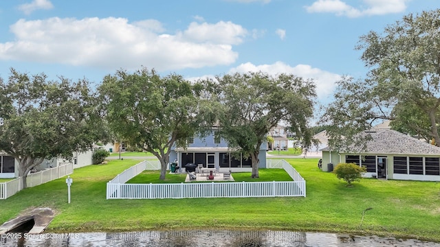 5060 Spinet Dr, Melbourne, FL 32940 - rear view of house featuring a sunroom and a water view
