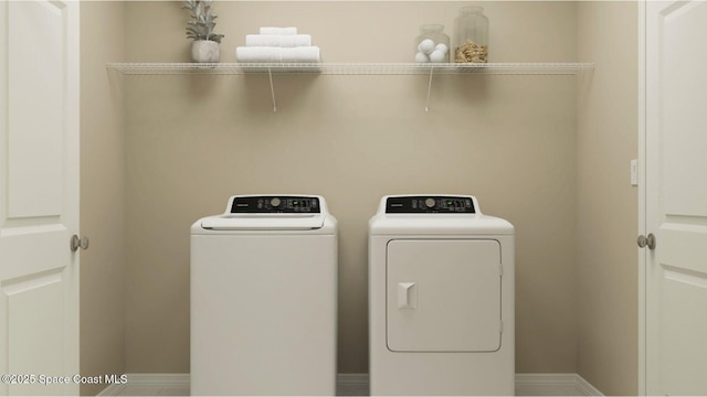 1862 San Filippo Dr SE, Palm Bay, FL 32909 - laundry room with separate washer and dryer and baseboards