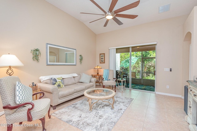 2009 Tullagee Ave, Melbourne, FL 32940 - living area with a ceiling fan, arched walkways, baseboards, light tile patterned flooring, and high vaulted ceiling