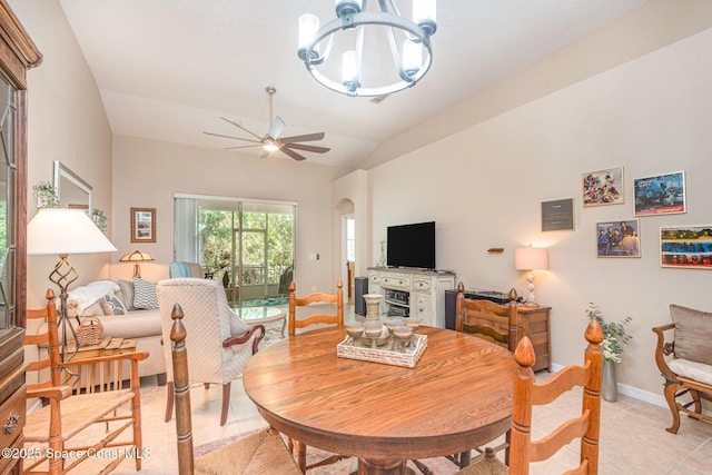 2009 Tullagee Ave, Melbourne, FL 32940 - dining space featuring a chandelier, ceiling fan, vaulted ceiling, arched walkways, and baseboards