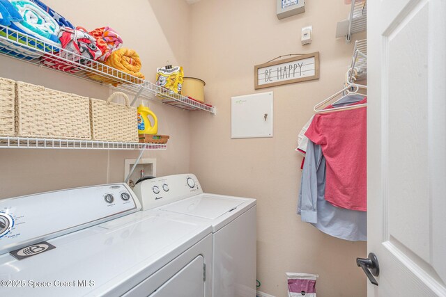 2009 Tullagee Ave, Melbourne, FL 32940 - washroom with washer and clothes dryer and baseboards