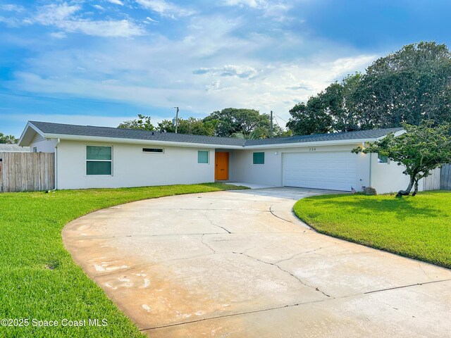 234 Micanopy Ct, Indian Harbour Beach, FL 32937 - view of front of property featuring stucco siding, an attached garage, and concrete driveway