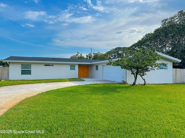 234 Micanopy Ct, Indian Harbour Beach, FL 32937 - view of front of property with stucco siding, an attached garage, and concrete driveway