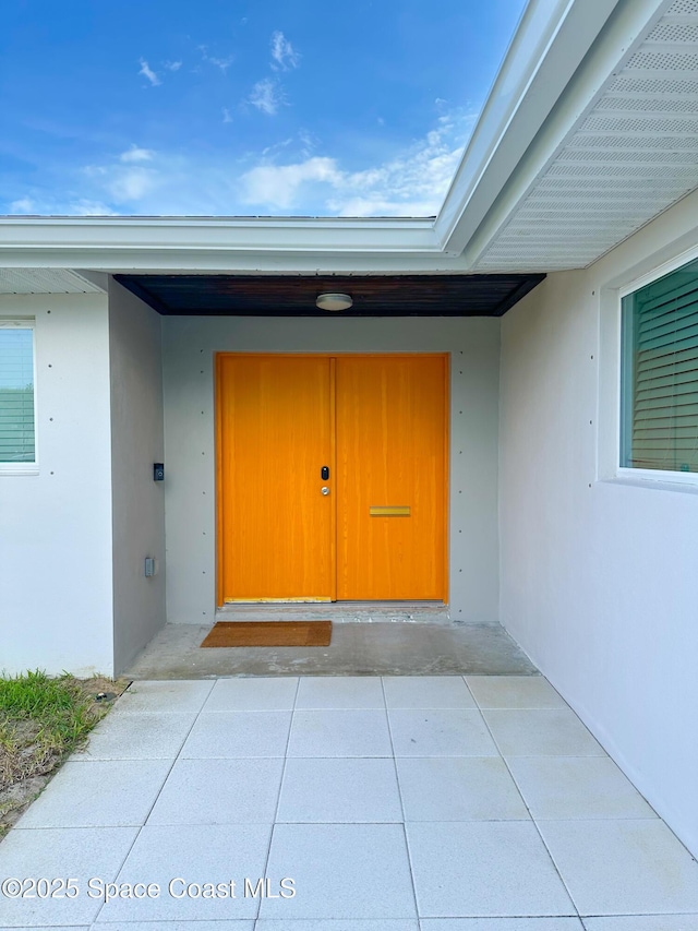 234 Micanopy Ct, Indian Harbour Beach, FL 32937 - property entrance featuring stucco siding