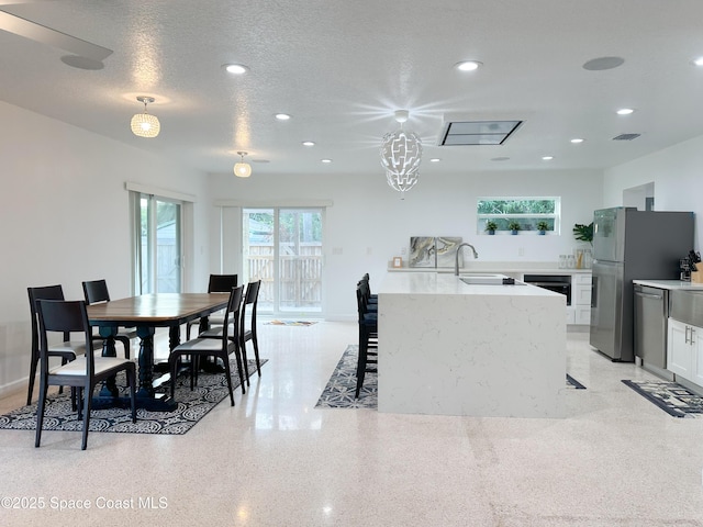 234 Micanopy Ct, Indian Harbour Beach, FL 32937 - dining space featuring dark speckled floor, recessed lighting, and a textured ceiling