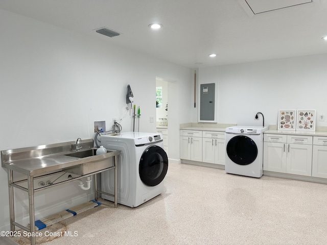 234 Micanopy Ct, Indian Harbour Beach, FL 32937 - laundry room with electric panel, cabinet space, washing machine and dryer, and recessed lighting