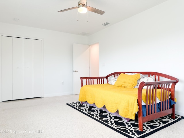 234 Micanopy Ct, Indian Harbour Beach, FL 32937 - bedroom with baseboards, speckle patterned floor, a ceiling fan, and a closet