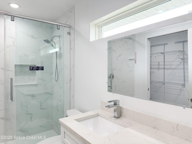 234 Micanopy Ct, Indian Harbour Beach, FL 32937 - bathroom featuring vanity, a shower stall, toilet, and recessed lighting