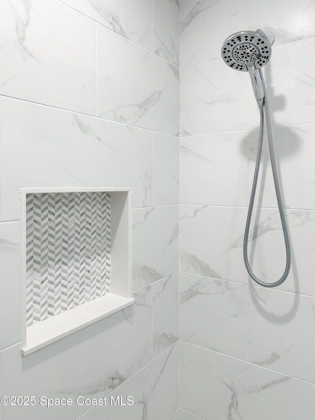 234 Micanopy Ct, Indian Harbour Beach, FL 32937 - bathroom featuring tiled shower