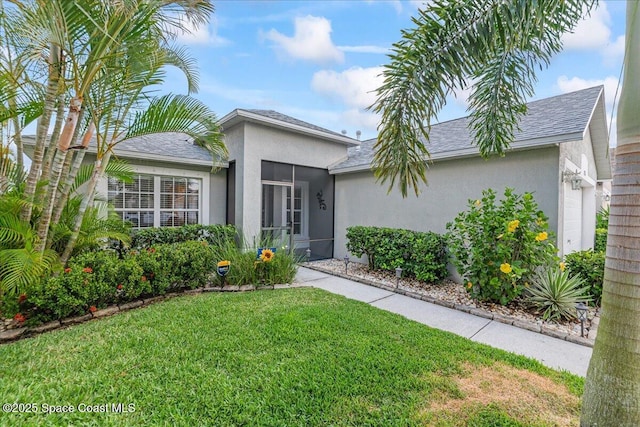 1776 Sawgrass Dr SW, Palm Bay, FL 32908 - ranch-style house featuring a front lawn, stucco siding, and roof with shingles
