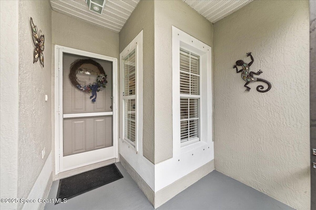 1776 Sawgrass Dr SW, Palm Bay, FL 32908 - doorway to property with stucco siding