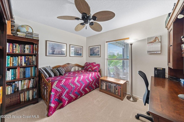 1776 Sawgrass Dr SW, Palm Bay, FL 32908 - carpeted bedroom with an office area, a ceiling fan, a textured ceiling, and baseboards