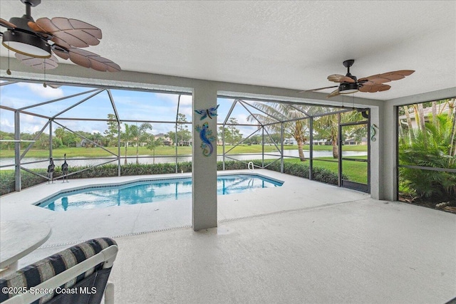1776 Sawgrass Dr SW, Palm Bay, FL 32908 - swimming pool with ceiling fan, a lanai, and a patio