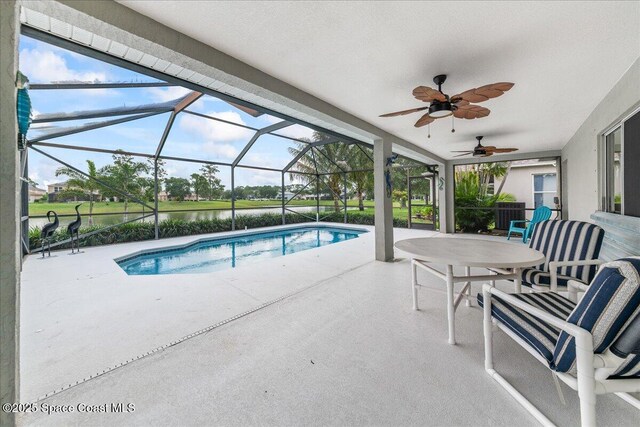 1776 Sawgrass Dr SW, Palm Bay, FL 32908 - swimming pool featuring a patio area, a ceiling fan, and glass enclosure