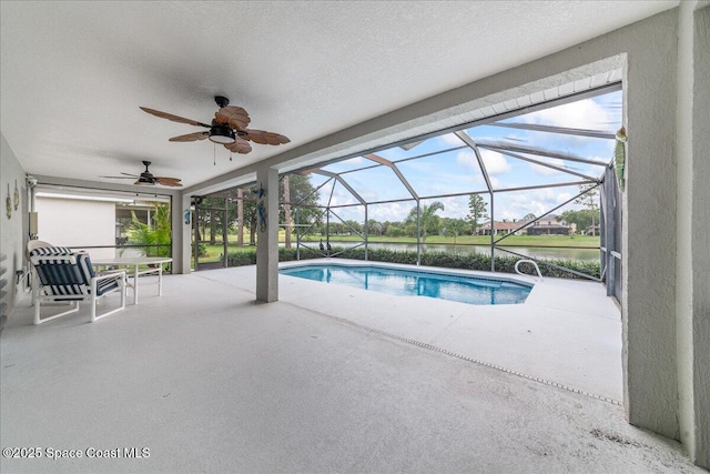 1776 Sawgrass Dr SW, Palm Bay, FL 32908 - swimming pool featuring ceiling fan, a patio, glass enclosure, and a water view