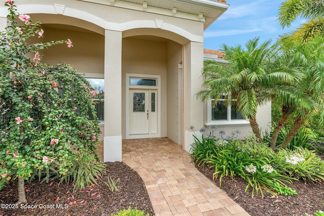 3360 Thurloe Dr, Rockledge, FL 32955 - doorway to property with stucco siding