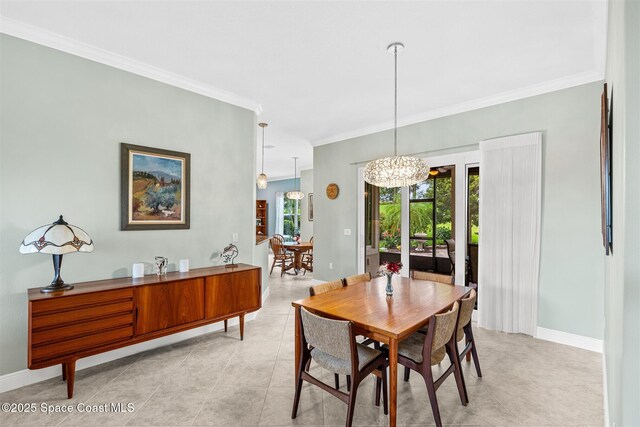 3360 Thurloe Dr, Rockledge, FL 32955 - dining space featuring crown molding, a chandelier, baseboards, and light tile patterned floors
