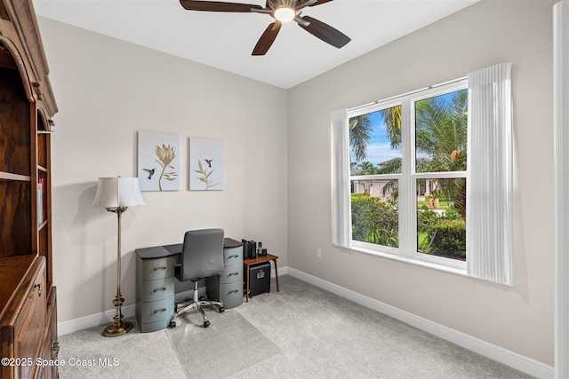 3360 Thurloe Dr, Rockledge, FL 32955 - carpeted home office with baseboards and a ceiling fan