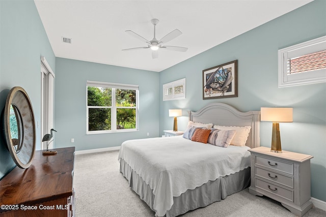 3360 Thurloe Dr, Rockledge, FL 32955 - bedroom with light carpet, baseboards, and a ceiling fan