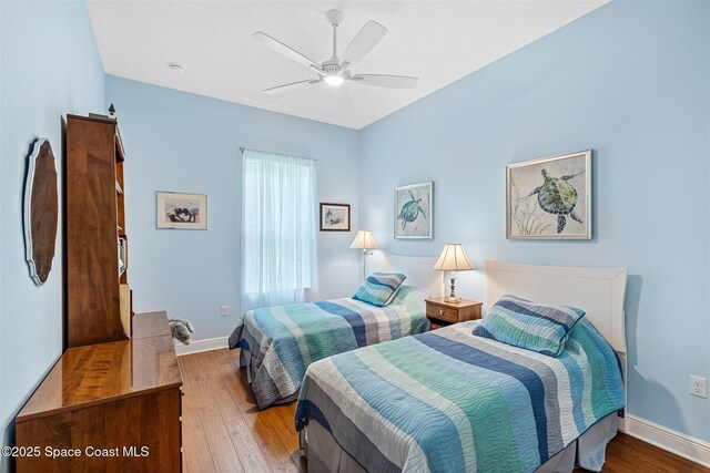 3360 Thurloe Dr, Rockledge, FL 32955 - bedroom featuring wood finished floors, baseboards, and a ceiling fan