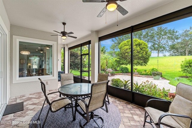 3360 Thurloe Dr, Rockledge, FL 32955 - sunroom with ceiling fan and outdoor dining area