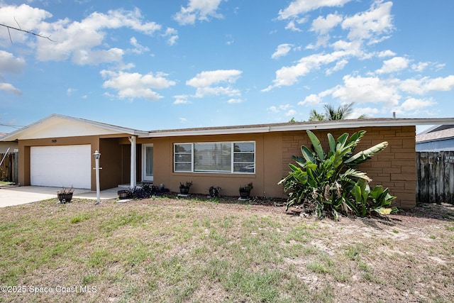 1505 W Central Ave, Merritt Island, FL 32952 - ranch-style house with an attached garage, stucco siding, and concrete driveway