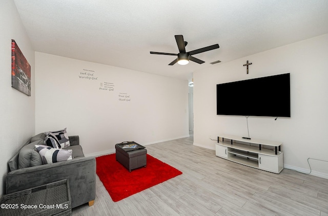1505 W Central Ave, Merritt Island, FL 32952 - living area featuring wood finished floors, ceiling fan, and baseboards