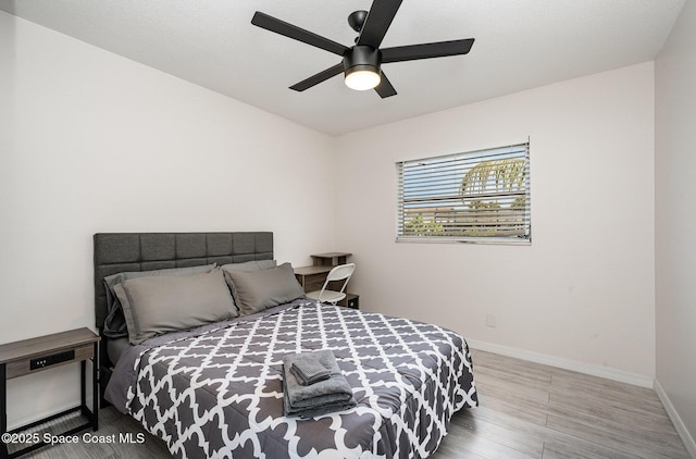 1505 W Central Ave, Merritt Island, FL 32952 - bedroom with baseboards, wood finished floors, and ceiling fan