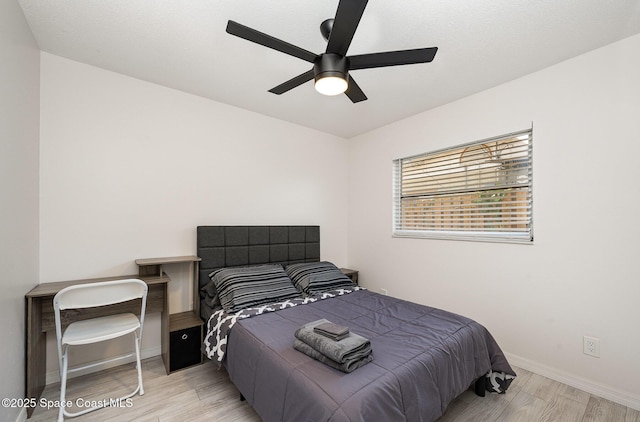 1505 W Central Ave, Merritt Island, FL 32952 - bedroom with light wood-type flooring, baseboards, and ceiling fan