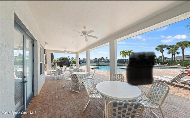 3130 Atocha Ln, Indialantic, FL 32903 - view of patio with a community pool and ceiling fan