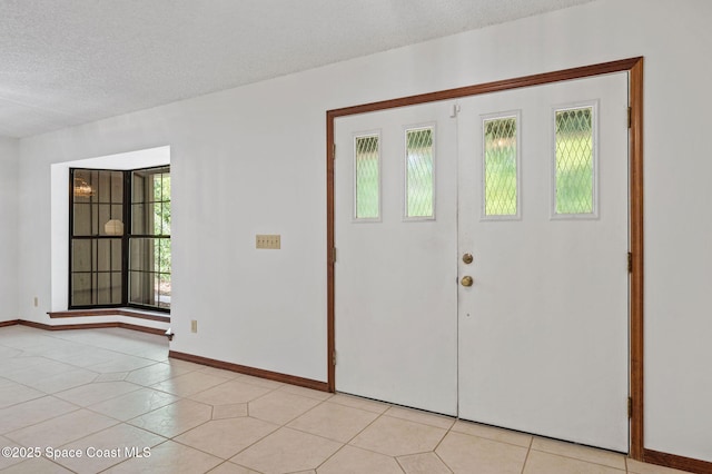 7001 Windover Way, Titusville, FL 32780 - entrance foyer with a textured ceiling and light tile patterned flooring