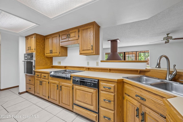 7001 Windover Way, Titusville, FL 32780 - kitchen featuring stainless steel appliances, light tile patterned flooring, a textured ceiling, brown cabinets, and light countertops