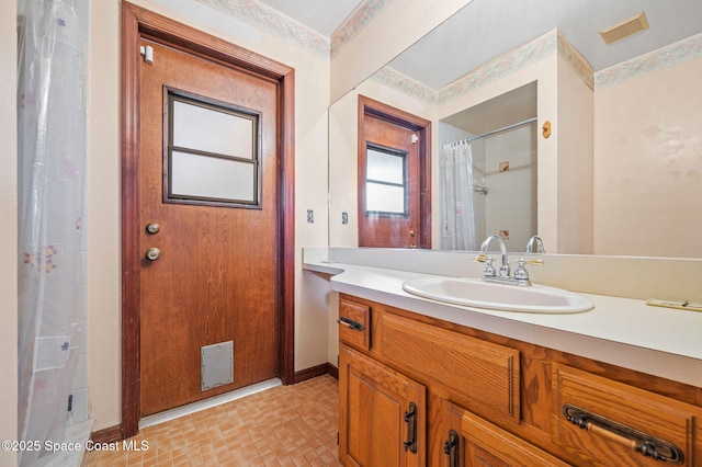 7001 Windover Way, Titusville, FL 32780 - bathroom featuring vanity and curtained shower