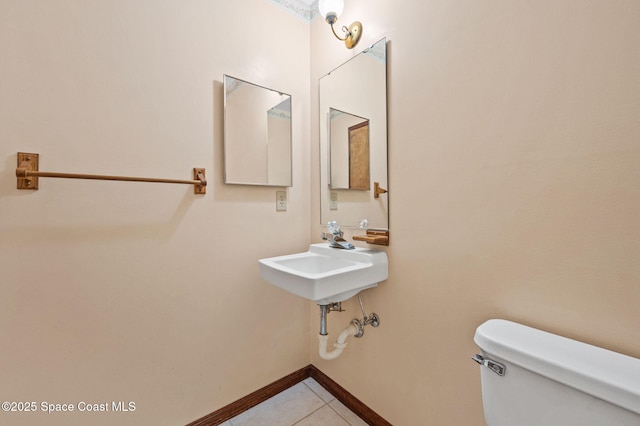 7001 Windover Way, Titusville, FL 32780 - half bath featuring toilet and tile patterned floors