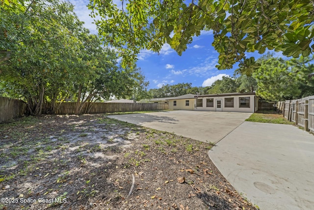 2036 Hogan Dr, Melbourne, FL 32935 - fenced backyard with a patio