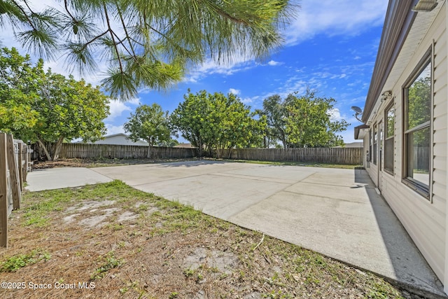2036 Hogan Dr, Melbourne, FL 32935 - fenced backyard featuring a patio area
