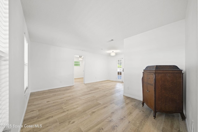 2036 Hogan Dr, Melbourne, FL 32935 - empty room featuring light wood-style floors, baseboards, and a ceiling fan