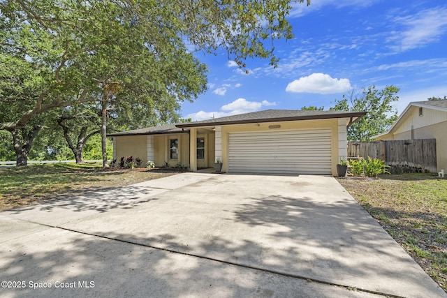 2036 Hogan Dr, Melbourne, FL 32935 - single story home featuring an attached garage, concrete driveway, and stucco siding